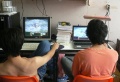 2 men using their computers.jpg