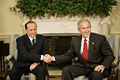 President George W Bush shakes hands with Italian Prime Minister Silvio Berlusconi.jpg