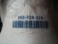 Neck barcode tattoo.jpg